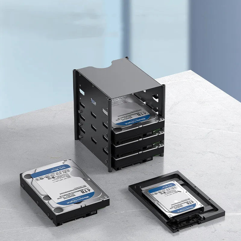 Black metal 5-layer hard drive storage bracket for 3.5-inch disks with screwdriver and screws on a desk