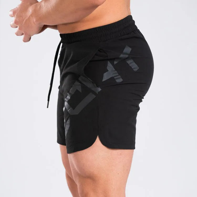 Men's black elastic training running shorts with knee-length cut and quick-dry fabric