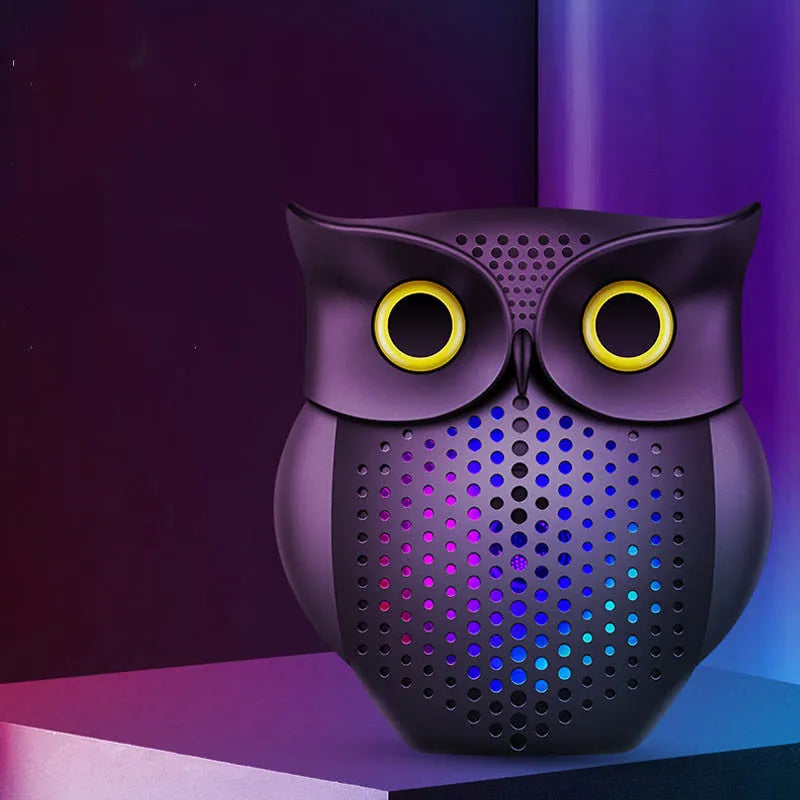 Black wireless Bluetooth speaker with a cartoon owl design on the front.
