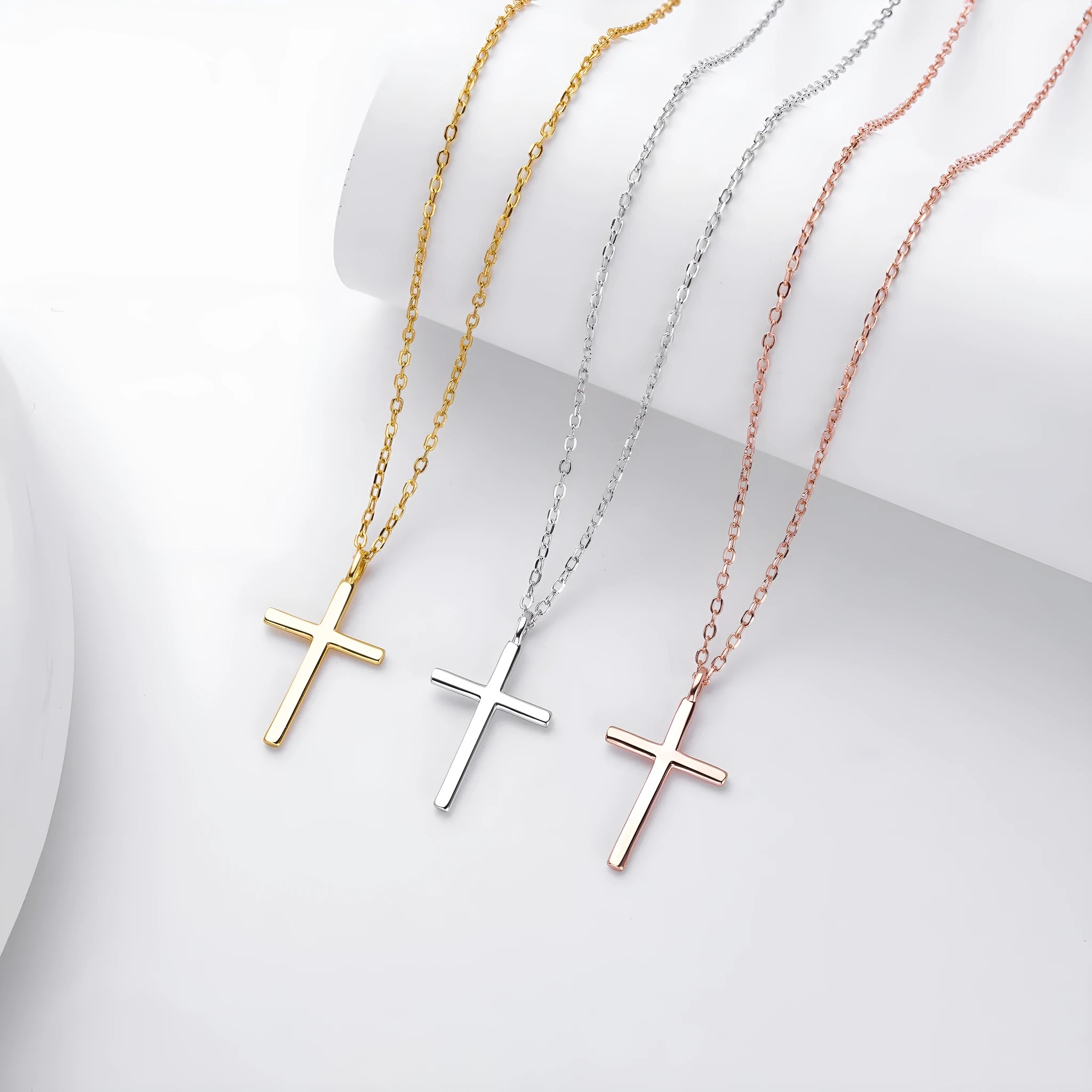 S925 sterling silver cross pendant necklace on an O-shaped chain in a gold electroplated finish.