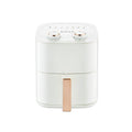 White air fryer with UK plug on a kitchen countertop, compact design with adjustable temperature control.