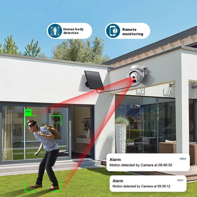 White solar-powered security camera with solar panel on top, mounted on an outdoor wall.