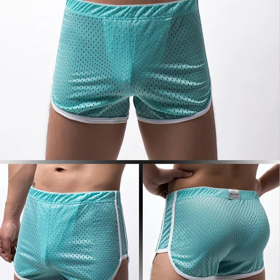 Men's grey three-point boxer shorts with a mid-waistband on a plain background.