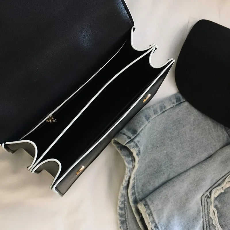 Designer diamond lock shoulder bag for women in quality PU leather, black colour option on display.