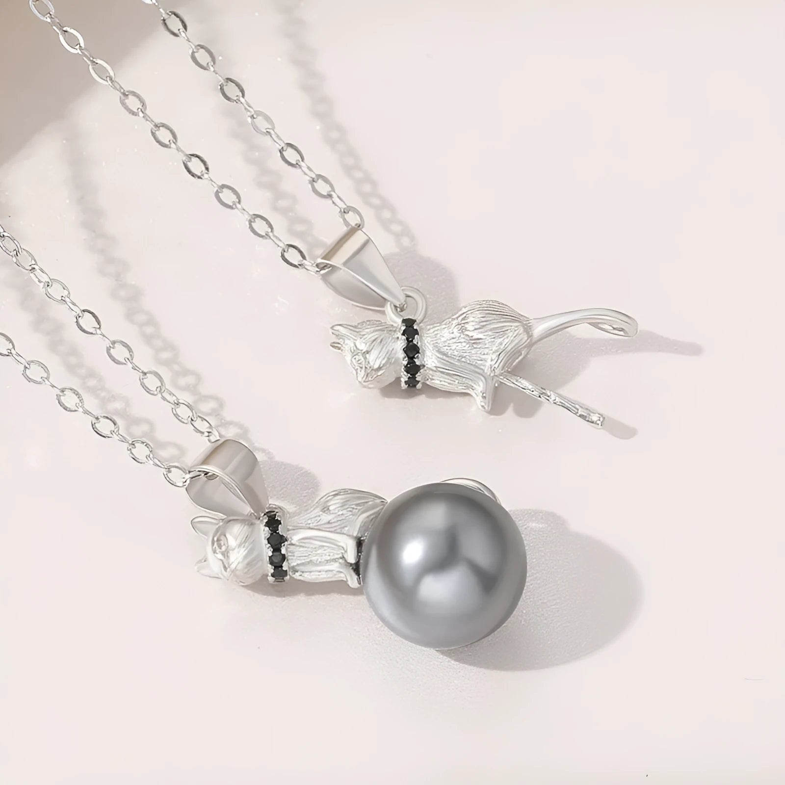 925 sterling silver cat pendant necklace with electroplated finish, shown as single pendant and with chain