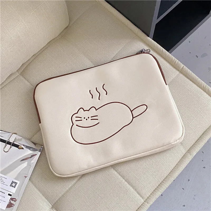 Fat cat embroidered design on a grey nylon laptop protective sleeve with a black zipper.