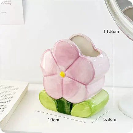 Ceramic pen holder box with floral pattern for desk organisation.