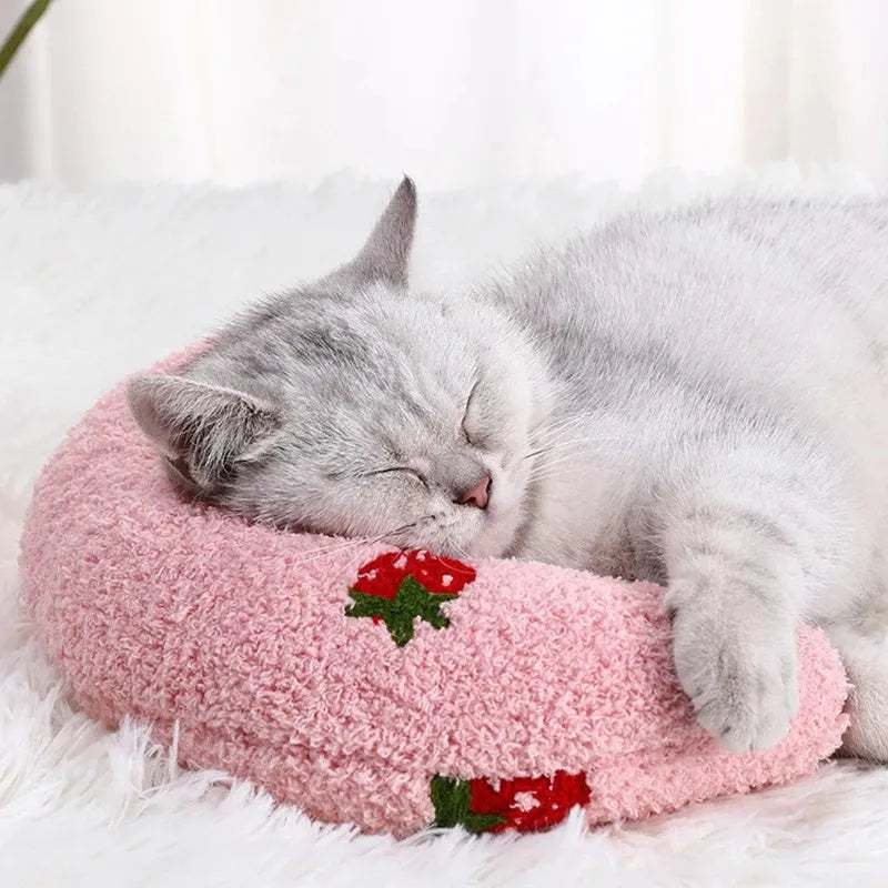 Soft quilted U-shaped cat pillow in blue, 26x18cm, on a clean white background