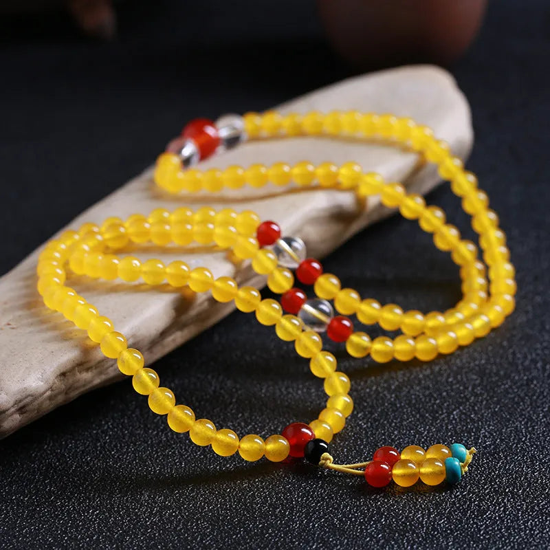 108-bead agate necklace with crystal lucky cat charm and geometric polished beads