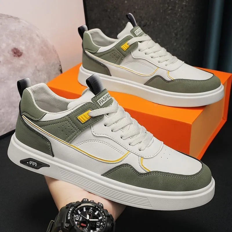 Men's low-top canvas board shoes in grey with leather stitching detail on a white background.