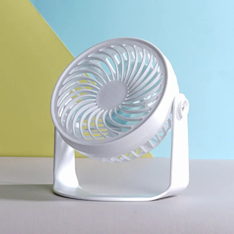 Small white USB desk fan shown in clip-on and floor-standing styles on a wooden desk