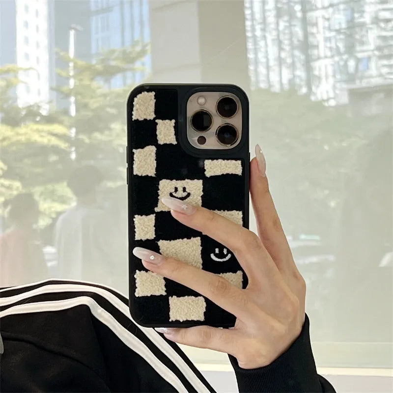 Black and white chessboard TPU phone case for iPhone with precise cutouts on a white background