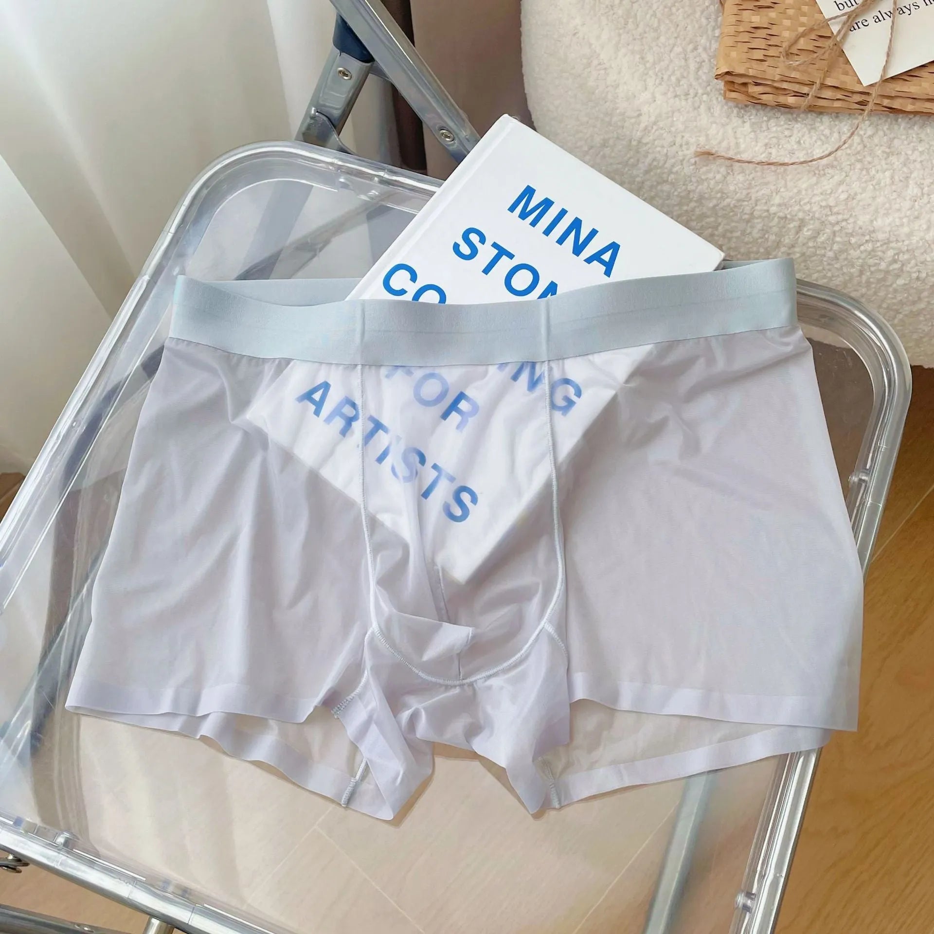 Man wearing thin grey seamless nylon boxer shorts with a mid-waist design.