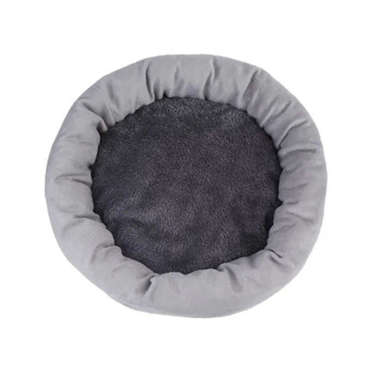 Light grey cotton-filled dog bed for a medium-sized dog with a matching pillow.