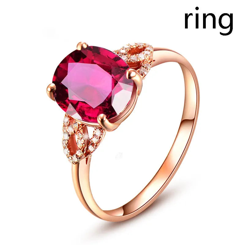 Red heart-shaped rotating ring box with 3D white rose decoration on top.