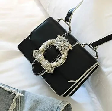 Designer diamond lock shoulder bag for women in quality PU leather, black colour option on display.