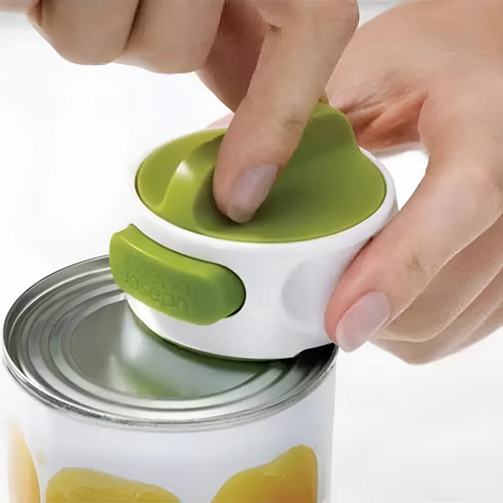 Green stainless steel bottle opener kitchen tool on countertop
