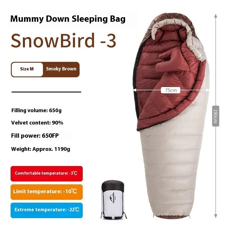 Blue and grey mummy-style down sleeping bag packed in its storage bag for camping.