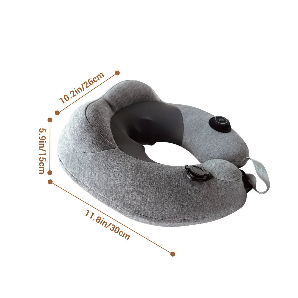 Gray inflatable U shape neck massager pillow with kneading 3 modes, deflated on a table with carry bag and USB cable