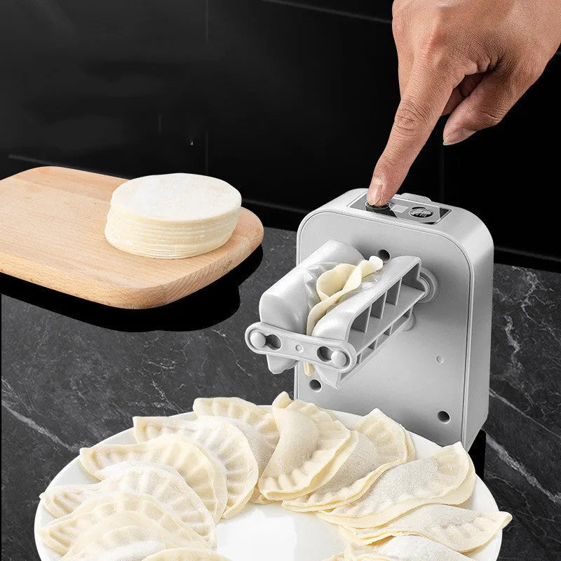 White electric dumpling maker machine with USB charging cable and accessories