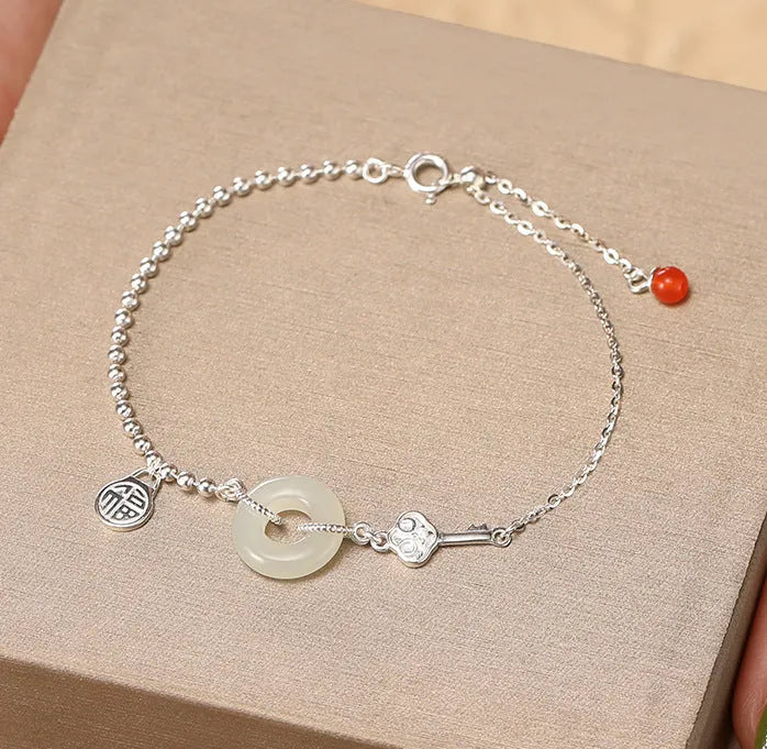 Women's Chinese style Hetian jade bracelet in 925 silver with geometric design and electroplated finish