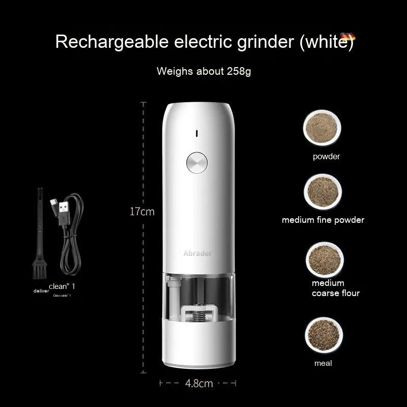 Black and silver electric pepper and salt grinder set with clear acrylic body on a kitchen counter.