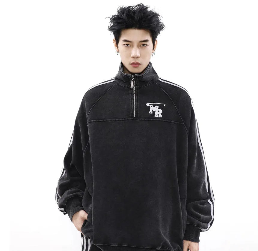 Black retro stand collar polyester hoodie coat for men and women on a hanger.