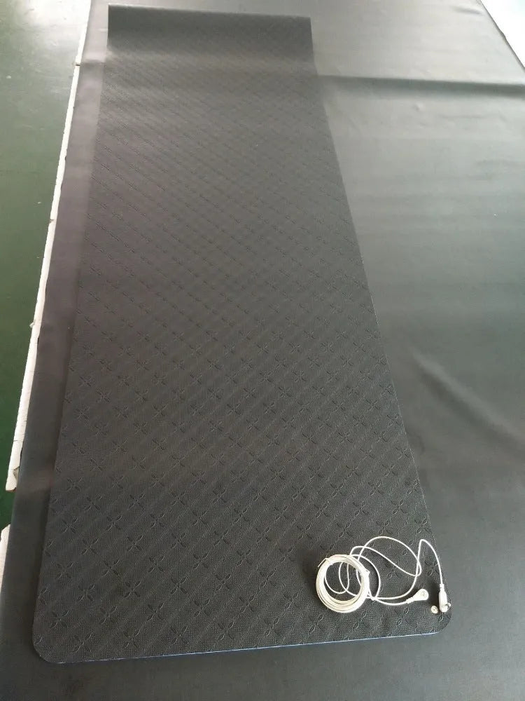 Blue conductive yoga mat with plant pattern and grounding wire, showing non-slip texture and 182cm length.