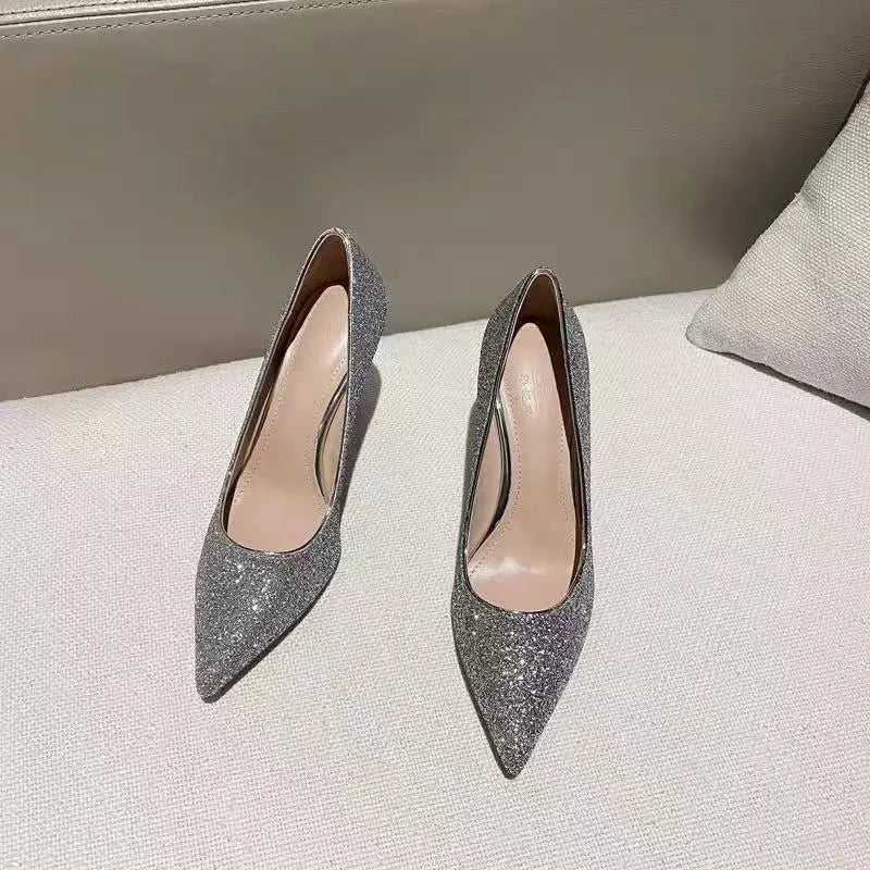 Women's silver crystal stiletto bridal shoe with a PU upper on a white background.