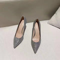 Women's silver crystal stiletto bridal shoe with a PU upper on a white background.