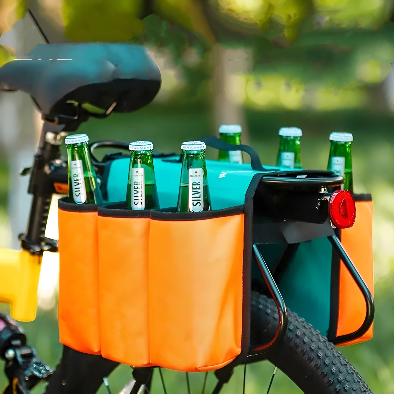 Black bicycle drink cage storage bag mounted on a bottle cage, showing its 2-litre capacity and scratch-resistant side panels.