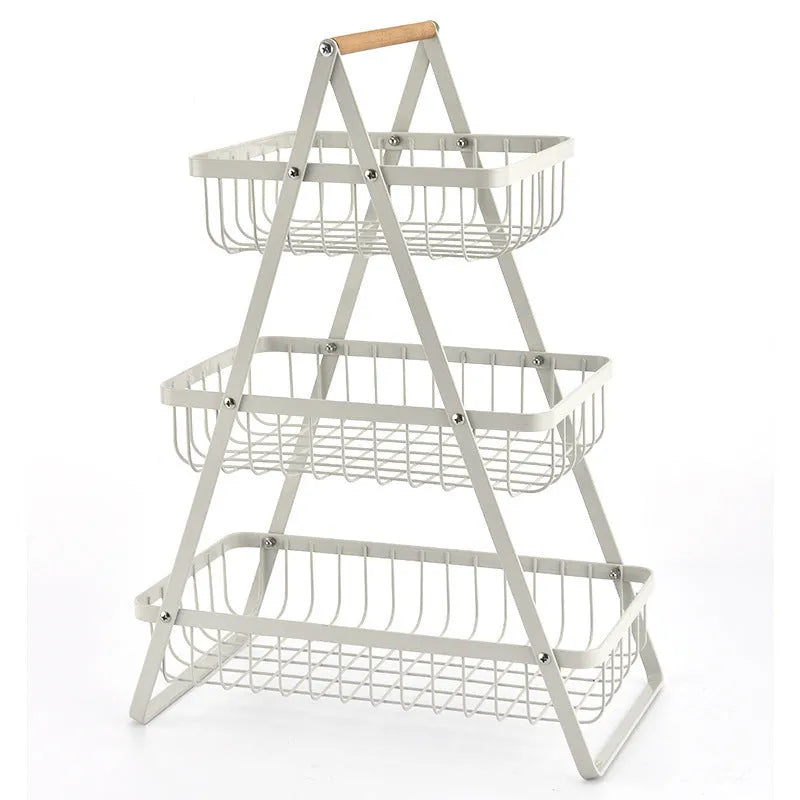 Black detachable iron double-layer fruit basket with a wooden carry handle on a tabletop.