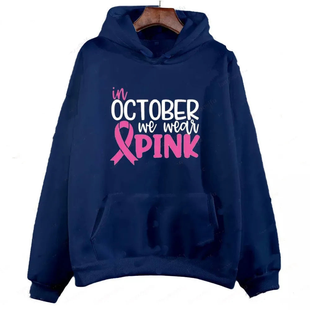 I'm A Survivor retro graphic hoodie in pink colour with side seam pockets, showing long-sleeve pullover design.