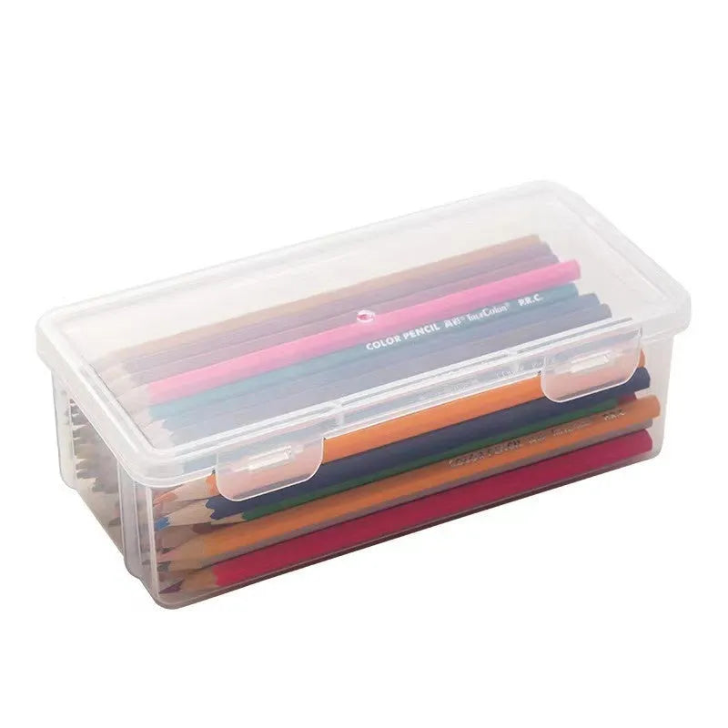 Large transparent pencil storage box with compartments for organising coloured pencils and drawing materials