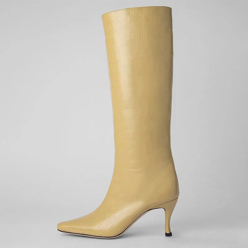Women's black square toe cowboy boots with a block heel on a white background