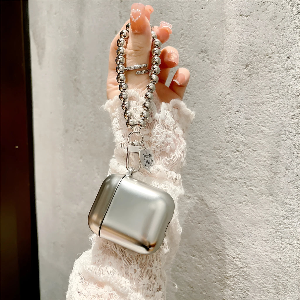 Matte plating colour TPU protective case for AirPods with an attached carrying bracelet.
