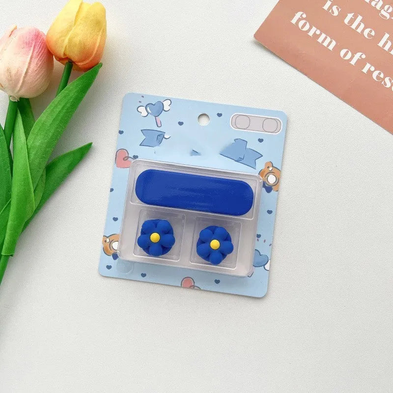 Plastic cartoon-style magnetic data cable fixer clip on a desktop