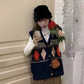 Khaki sleeveless loose cardigan top with diamond plaid pattern, open front.