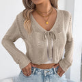 Women's khaki lace-up hollow-out long sleeve viscose coat on a hanger