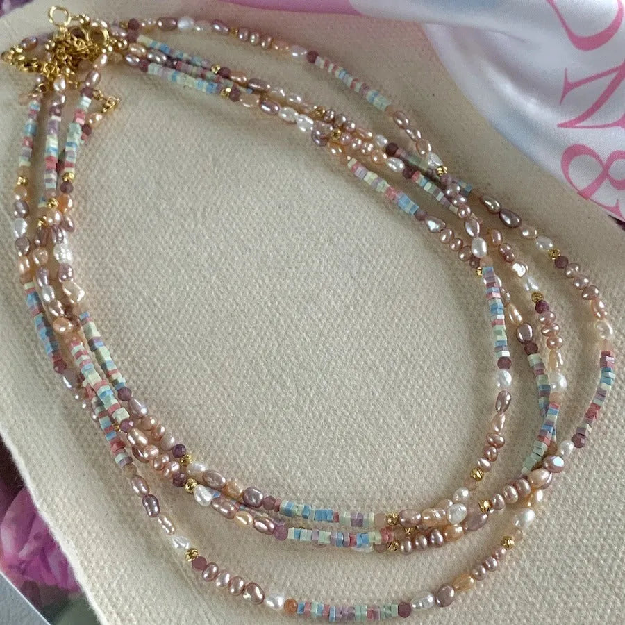 Women's natural pearl bracelet and necklace set with silver pearls and gilded purple 14K plating.
