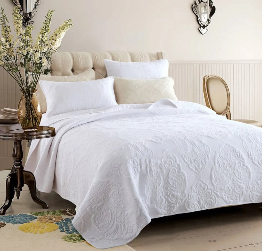 Three-piece pure cotton quilted bed cover set in white with Nordic floral embroidery on a 1.8m bed