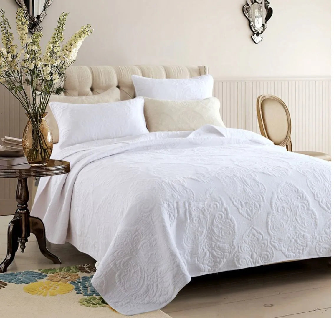 Three-piece pure cotton quilted bed cover set in white with Nordic floral embroidery on a 1.8m bed