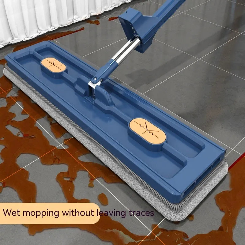 Large flat mop with blue cloths on stainless steel handle showing 360 degree rotating head mechanism