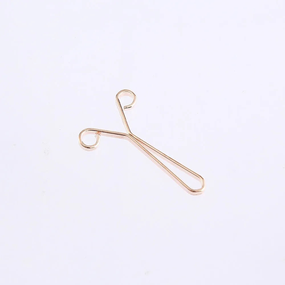 Iron scarf clip with electroplated finish in rose gold colour on a silk scarf