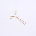 Iron scarf clip with electroplated finish in rose gold colour on a silk scarf