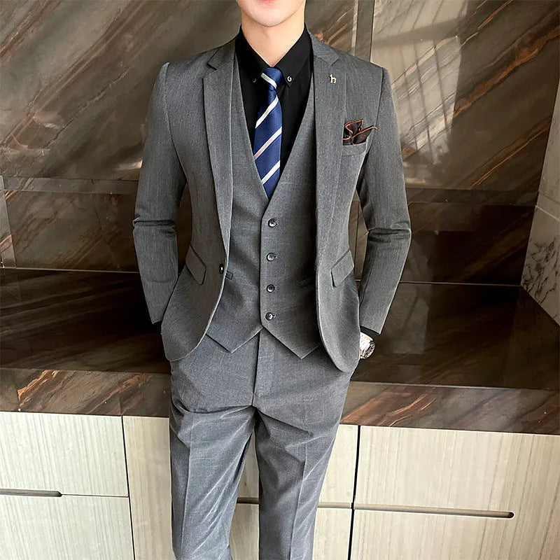 Slim fit British style suit for men in black or dark grey business formal wear