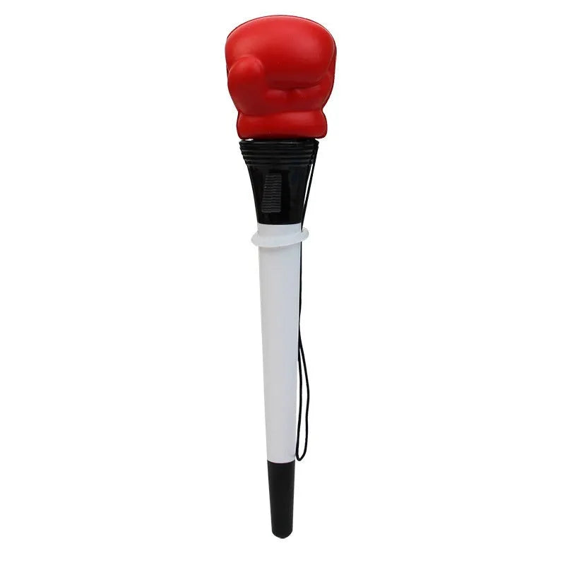 Set of four black creative pressure relief pens with boxing figure press-to-eject mechanism.
