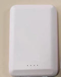 Magnetic wireless power bank in black, blue, green, pink, or white colour with 5000mAh capacity.