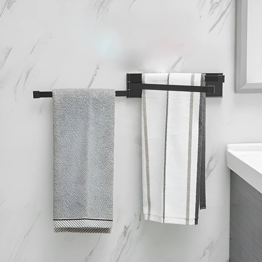 Nordic style black folding towel rack mounted on a bathroom wall with non-perforated installation.