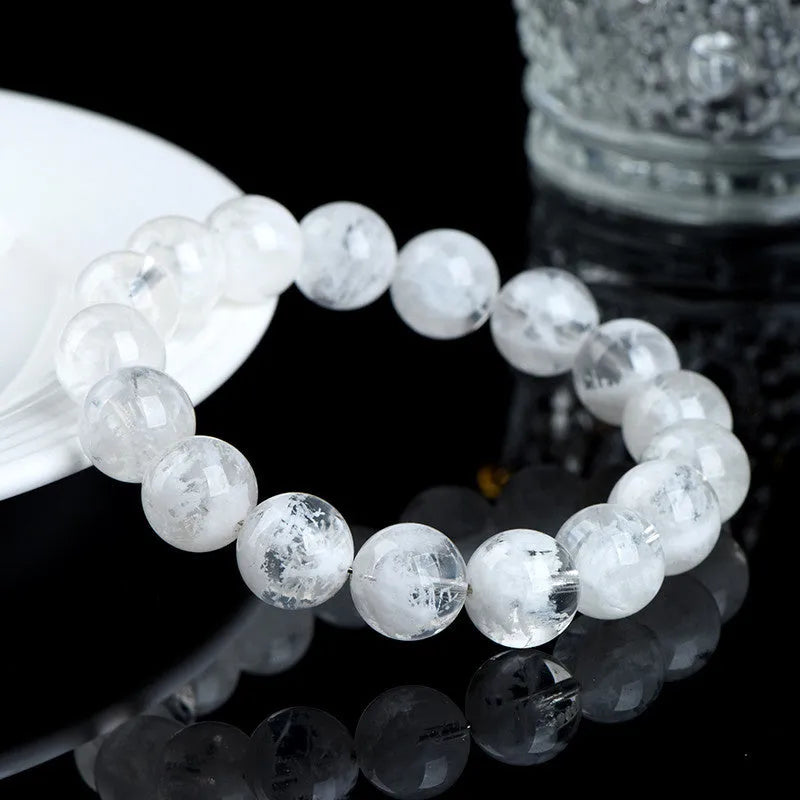 Women's crystal bracelet with round blizzard snowflake pattern beads, showing geometric and traditional design.